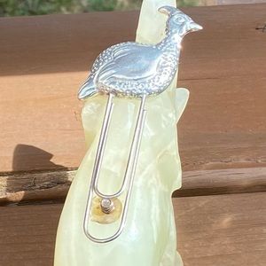 Vintage unsigned silver tone duck metal book mark, paper accessory. Used.